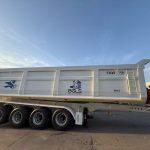 Four-axle rear-tipping semi-trailer